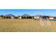 Community soccer field with two soccer goals and single park bench at 3454 Howell Dr, Lake Wales, FL 33859
