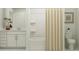 Bright bathroom featuring a vanity with storage, a bathtub-shower combo, and neutral tones at 3454 Howell Dr, Lake Wales, FL 33859