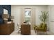 Bright home office featuring a wood desk, accent chairs, modern lamps, and a decorative plant at 3454 Howell Dr, Lake Wales, FL 33859