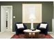 Inviting loft featuring comfortable chairs, a small coffee table, and tasteful artwork at 3454 Howell Dr, Lake Wales, FL 33859
