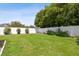 Spacious backyard featuring a lush lawn and privacy fence at 5446 Highlands Vista Cir, Lakeland, FL 33812