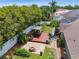 The backyard features a cozy gazebo with outdoor seating, a brick fire pit, and lush landscaping at 5446 Highlands Vista Cir, Lakeland, FL 33812