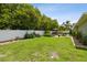 Large backyard featuring a white fence and a gazebo with outdoor seating at 5446 Highlands Vista Cir, Lakeland, FL 33812
