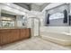 Bright bathroom with walk-in shower and soaking tub under a window with natural light at 5446 Highlands Vista Cir, Lakeland, FL 33812