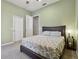 This carpeted bedroom has two closets, a ceiling fan, and neutral walls at 5446 Highlands Vista Cir, Lakeland, FL 33812