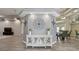Bright entryway features an accent wall, tiled floor, and views to a dining and living area at 5446 Highlands Vista Cir, Lakeland, FL 33812