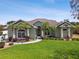 Charming single-story home with well-maintained landscaping and inviting entrance at 5446 Highlands Vista Cir, Lakeland, FL 33812