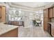 Bright kitchen with wood cabinets, stainless steel appliances, and an open layout connecting to the dining and living spaces at 5446 Highlands Vista Cir, Lakeland, FL 33812