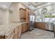 Kitchen featuring wood cabinets, granite countertops, stainless appliances and tile floors at 5446 Highlands Vista Cir, Lakeland, FL 33812
