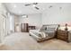 Serene main bedroom featuring a cozy king bed, soft carpet, and ample space for relaxation at 5446 Highlands Vista Cir, Lakeland, FL 33812