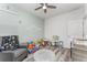 Bright bedroom area, toys, wood-look floors, decorated with -like decor and a ceiling fan at 140 Trinity Ridge Cir, Davenport, FL 33897