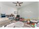 Bright bedroom area, toys, wood-look floors, ceiling fan and decorated with -like decor at 140 Trinity Ridge Cir, Davenport, FL 33897