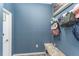 Mud room with hooks for bags and coats and a bench for seating at 140 Trinity Ridge Cir, Davenport, FL 33897