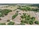 Expansive aerial view of the farm's grounds and paddocks, showcasing the property's vastness and equestrian amenities at 25601 Hutcheson Ln, Sorrento, FL 32776