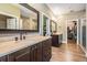 Primary bathroom features double vanities, walk-in shower, and access to a large walk-in closet at 25601 Hutcheson Ln, Sorrento, FL 32776