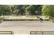 Well-maintained equestrian ring, perfect for training, with nice reflection screens and landscaping at 25601 Hutcheson Ln, Sorrento, FL 32776