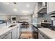 Bright kitchen with modern appliances, updated backsplash and breakfast bar area at 25601 Hutcheson Ln, Sorrento, FL 32776