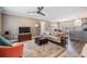 Comfortable living room adjacent to the kitchen with an open floor plan at 25601 Hutcheson Ln, Sorrento, FL 32776