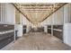 Interior of horse stables, showcasing the clean and organized stalls and ample space at 25601 Hutcheson Ln, Sorrento, FL 32776