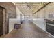 Spacious interior of stables featuring well-maintained stalls, stone-paved floors, and functional design at 25601 Hutcheson Ln, Sorrento, FL 32776