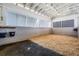 Spacious horse stall featuring white walls, bedding, and good ventilation for equine comfort at 25601 Hutcheson Ln, Sorrento, FL 32776