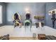 Organized tack room with saddles, bridles, and riding gear neatly arranged on the wall, showcasing equestrian amenities at 25601 Hutcheson Ln, Sorrento, FL 32776