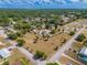 Wide aerial view showing a home with a spacious lot, nestled in a residential area with tree-lined streets at 4145 Willis Rd, Mulberry, FL 33860