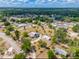 Aerial view of the property displaying the home, outbuildings, surrounding landscape, and location within a residential area at 4145 Willis Rd, Mulberry, FL 33860