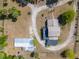 Aerial view of property showing the two-story home, outbuildings and expansive acreage at 4145 Willis Rd, Mulberry, FL 33860