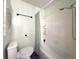 Clean bathroom with shower/tub combination, neutral tile, and fresh paint at 4145 Willis Rd, Mulberry, FL 33860