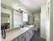 Bright bathroom offers dual sinks, granite countertop, and a well-lit vanity area at 4145 Willis Rd, Mulberry, FL 33860