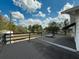 Open-air deck with views of the property, mature trees, and blue skies at 4145 Willis Rd, Mulberry, FL 33860