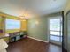 Bright dining area with natural light and an open doorway to the outside at 4145 Willis Rd, Mulberry, FL 33860