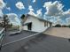 Two-story home with outdoor access from an open-air upper deck at 4145 Willis Rd, Mulberry, FL 33860