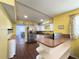 Updated kitchen featuring stainless steel appliances and peninsula with bar seating at 4145 Willis Rd, Mulberry, FL 33860