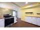 Open kitchen features stainless steel appliances, ample counter space, and modern light fixture at 4145 Willis Rd, Mulberry, FL 33860