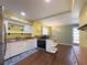 Modern kitchen with stainless steel appliances and open layout to dining area at 4145 Willis Rd, Mulberry, FL 33860