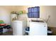 Functional laundry room with washer, dryer, and ample storage space at 4145 Willis Rd, Mulberry, FL 33860