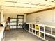 Interior view of outbuilding featuring shelving and workspace at 4145 Willis Rd, Mulberry, FL 33860