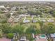 Residential area with mature trees, canal access, and some homes with pools at 5811 Lake Breeze Ave, Lakeland, FL 33809
