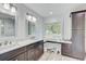 A spacious bathroom featuring double sinks, modern fixtures, and plenty of storage space at 5811 Lake Breeze Ave, Lakeland, FL 33809