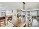 Bright dining room with a large table, modern lighting, and open to the kitchen at 5811 Lake Breeze Ave, Lakeland, FL 33809
