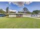 Charming single-story home with a well-manicured lawn and inviting curb appeal at 5811 Lake Breeze Ave, Lakeland, FL 33809