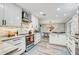 Stylish kitchen with stainless appliances, white cabinets, stone backsplash and eat in kitchen at 5811 Lake Breeze Ave, Lakeland, FL 33809