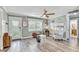 Bright and open living room with modern flooring, neutral walls and large windows at 5811 Lake Breeze Ave, Lakeland, FL 33809