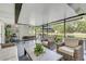 Relaxing screened porch features comfortable seating and view to the backyard at 5811 Lake Breeze Ave, Lakeland, FL 33809