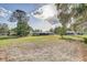 Large lot with mature trees, providing privacy and ample space for outdoor activities at 5811 Lake Breeze Ave, Lakeland, FL 33809