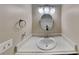 Bathroom featuring a vanity with a sink and a well-lit mirror, and a neutral wall color at 699 Sullivan St, Deltona, FL 32725