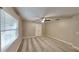 Serene bedroom featuring carpet flooring, neutral paint, an overhead ceiling fan, and a window for natural light at 699 Sullivan St, Deltona, FL 32725