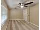 Neutral-colored bedroom with natural light, ceiling fan, and neutral carpeting at 699 Sullivan St, Deltona, FL 32725